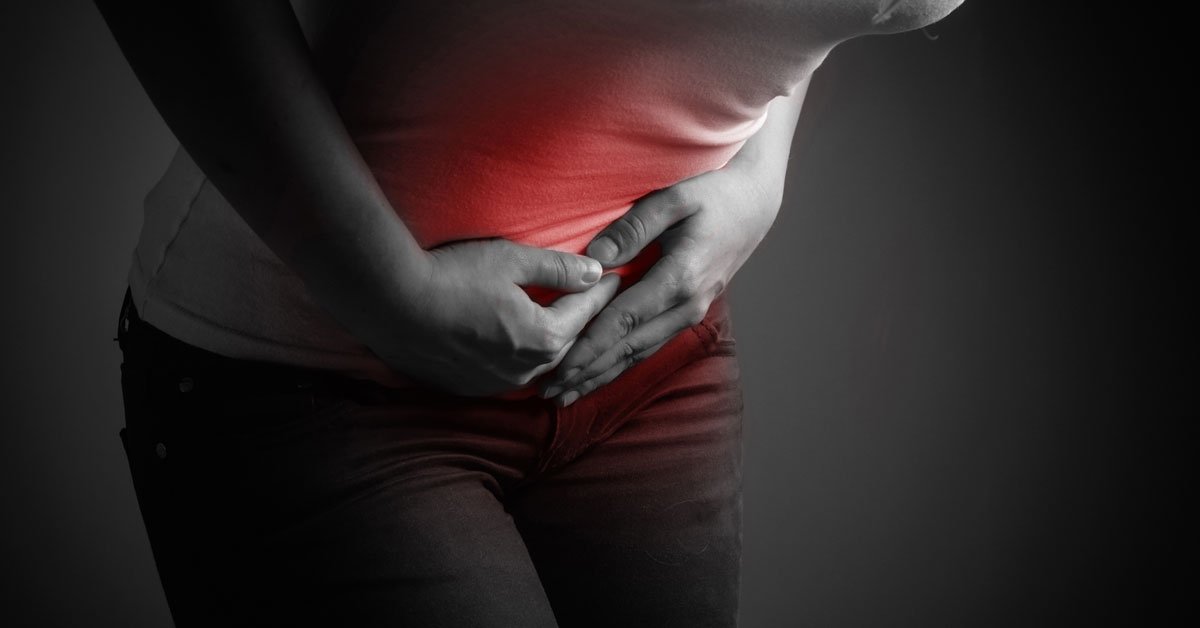 black and white photo with red near stomach representing endometriosis