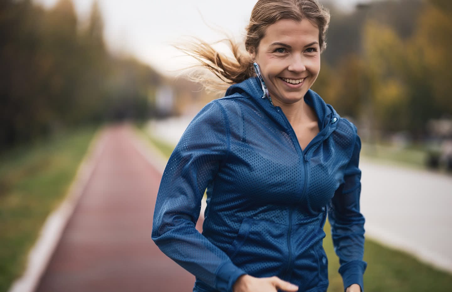 female running and smiling