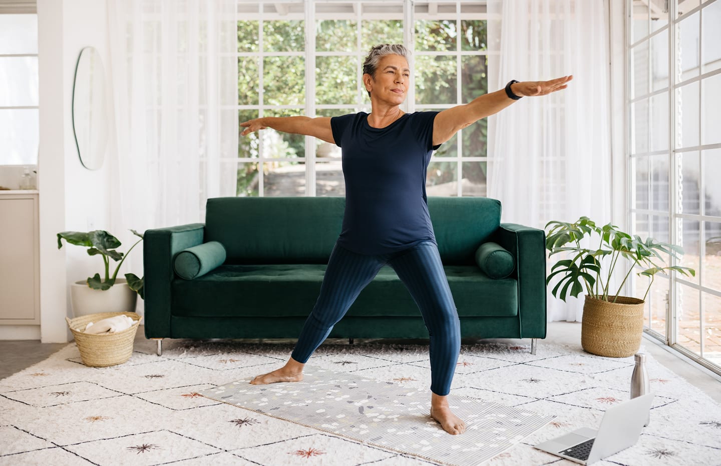 female standing doing a yoga stretch
