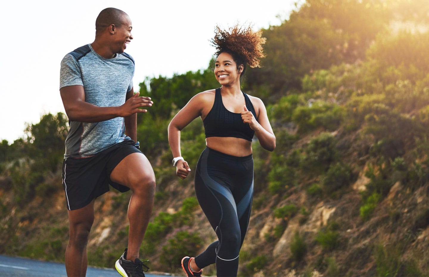Man and Woman smiling and running