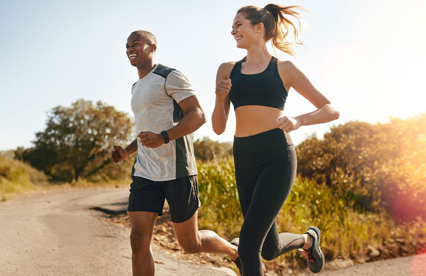 Man and woman smiling running