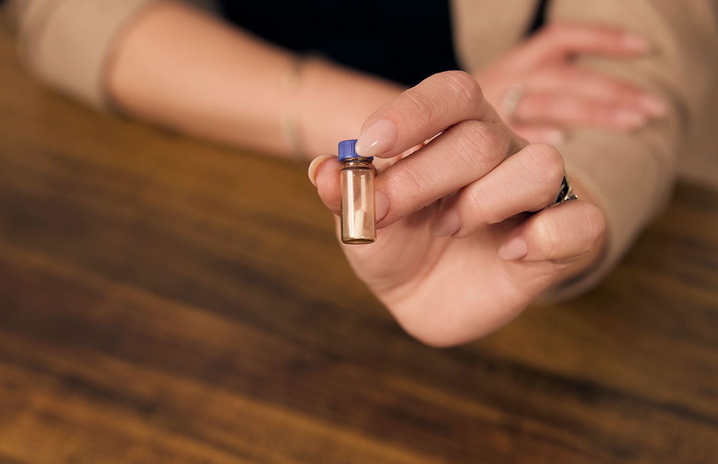 Bottle with a small pill in it