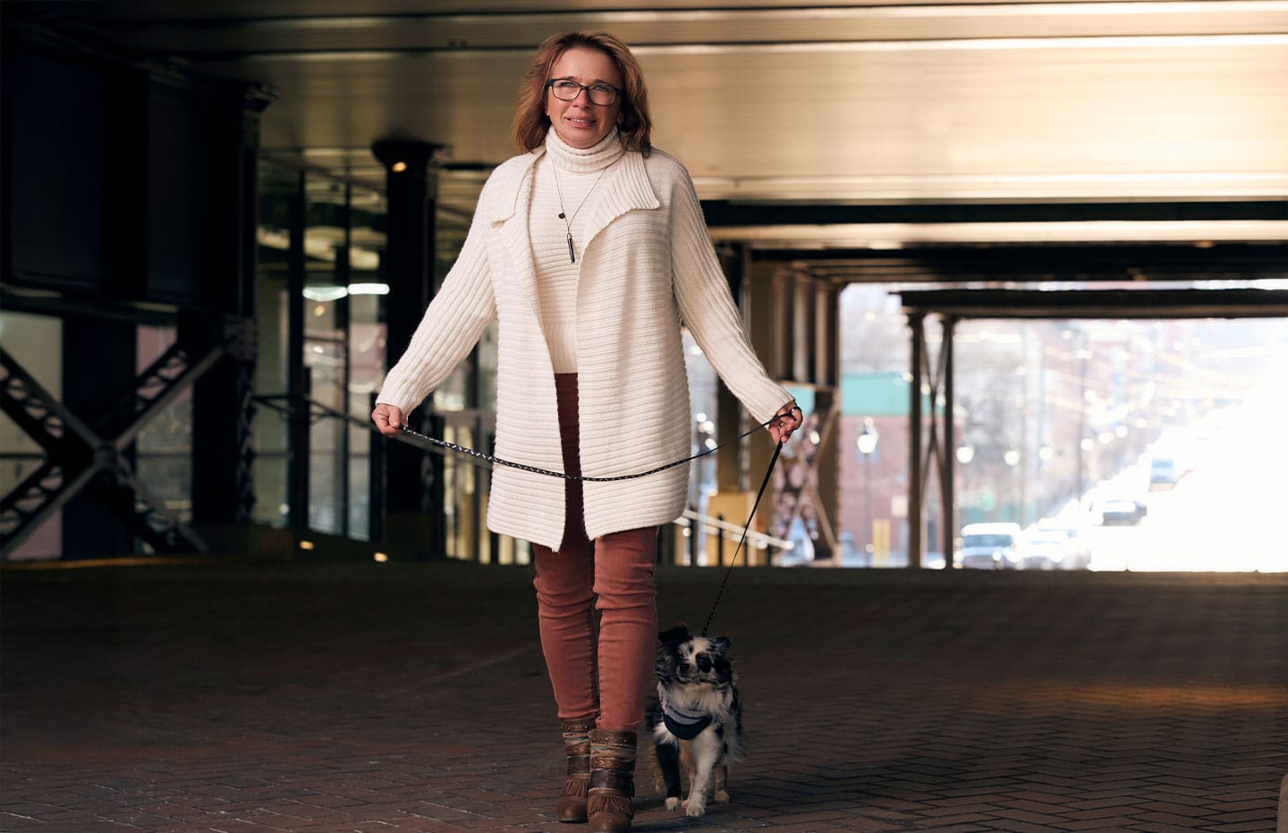 Woman with her dog on leash