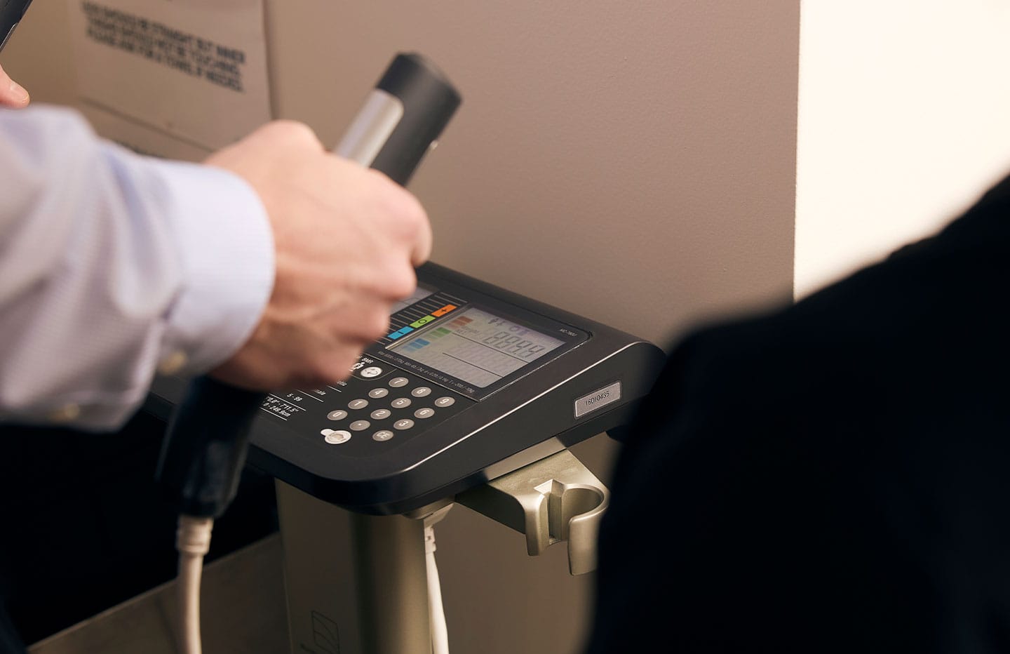 Close up photo of male using a medical machine