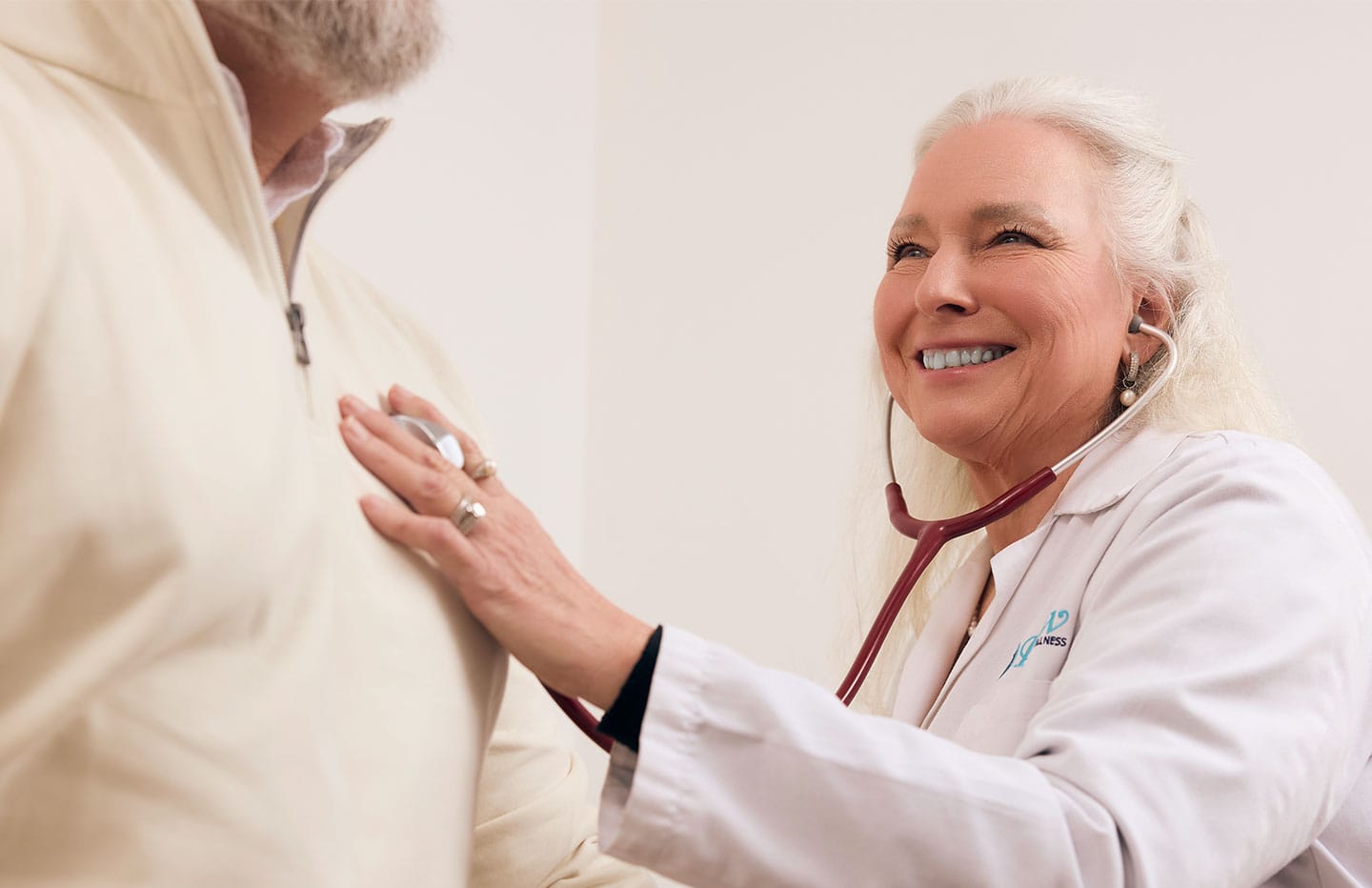 female doctor checking males heart rate