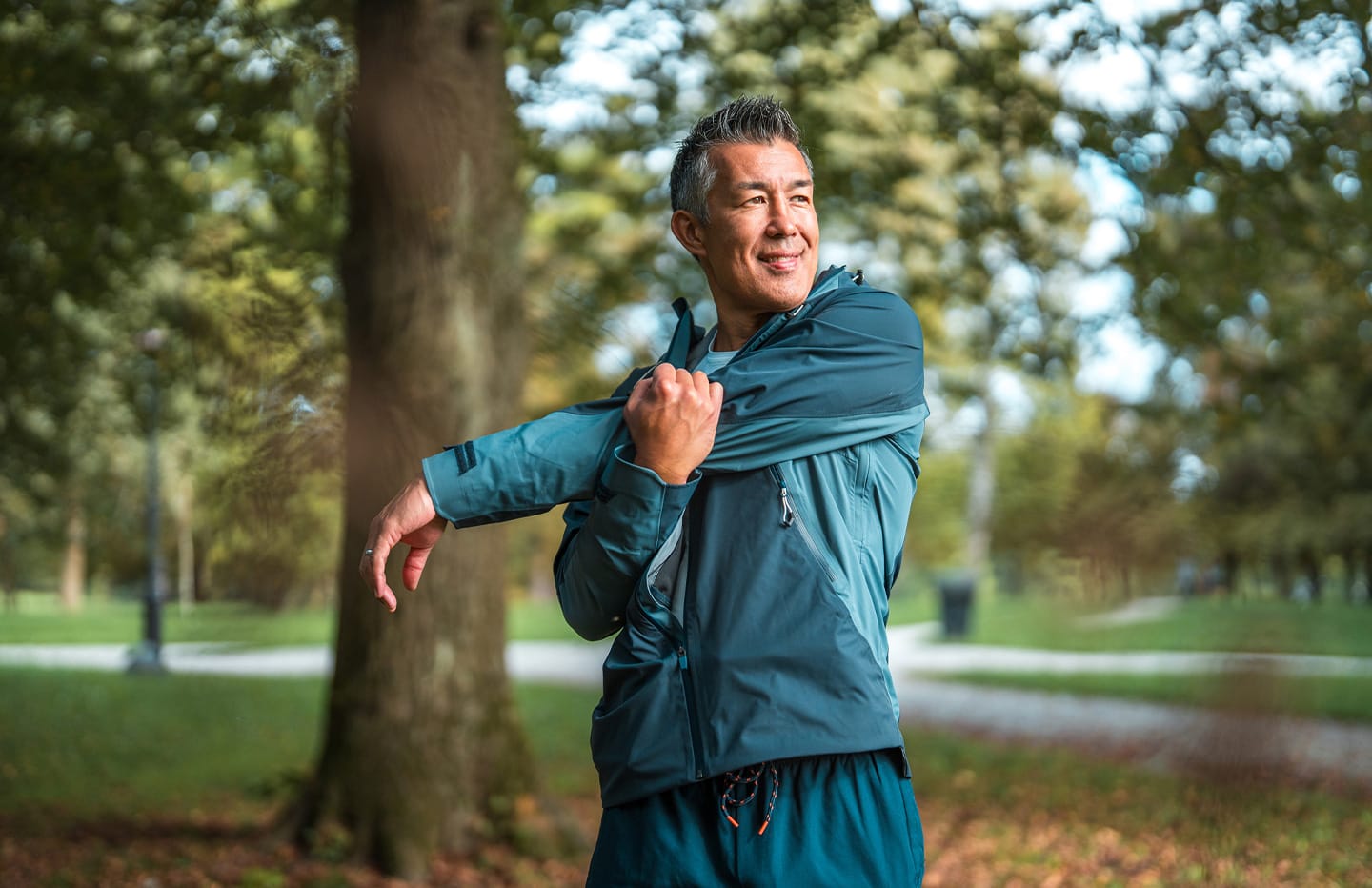 Man stretching and smiling