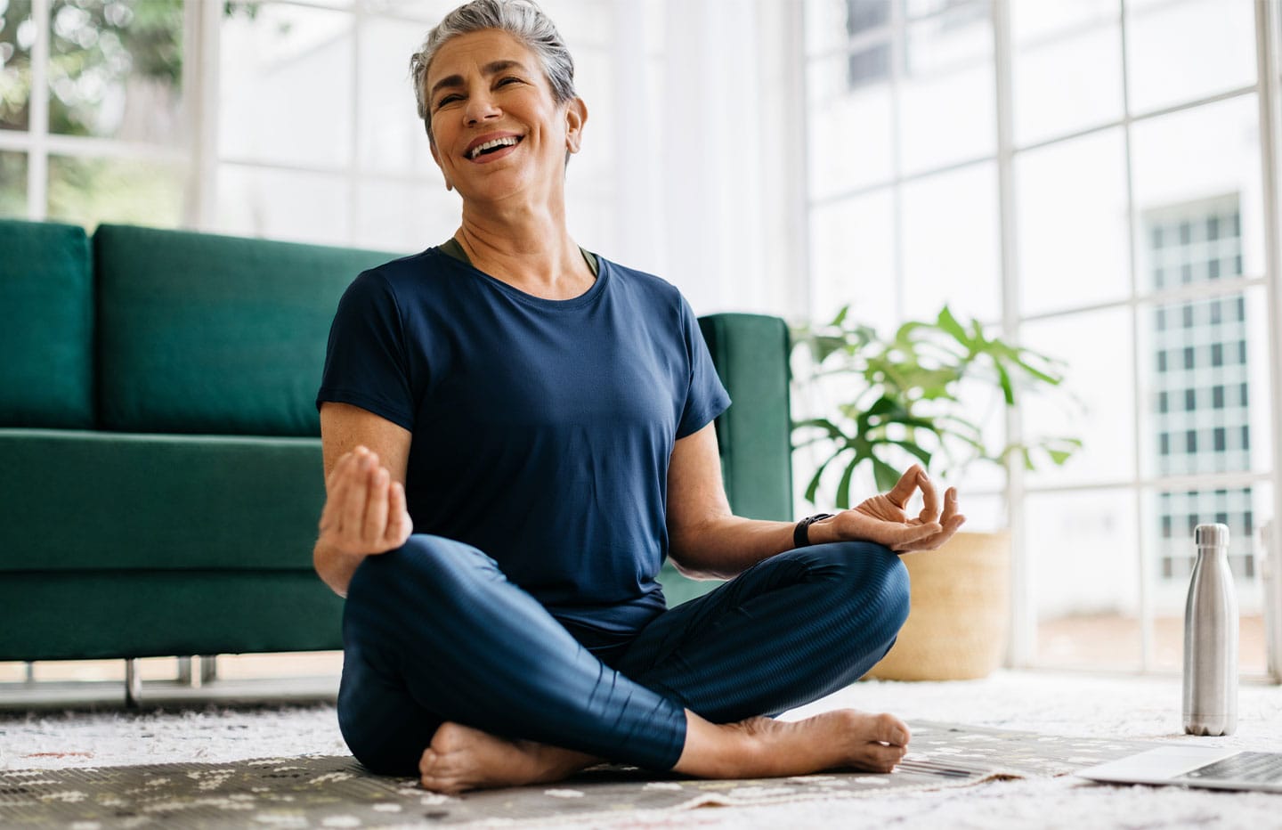 Woman meditating and smiling